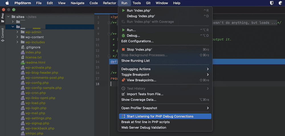 Una schermata dell'interfaccia PhpStorm parziale, che mostra una directory ad albero sulla sinistra e la barra degli strumenti dell'applicazione. Il menu Esegui è aperto e il