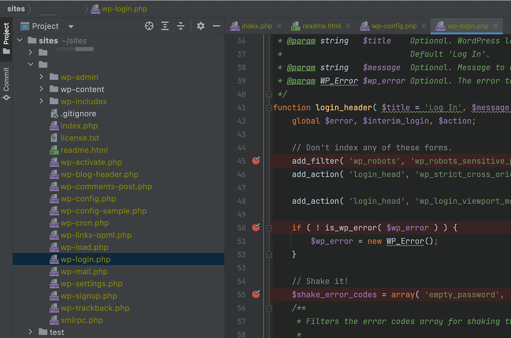 ภาพระยะใกล้ของอินเทอร์เฟซ PhpStorm แสดงไดเรกทอรีต้นไม้ทางด้านซ้าย และแผงการเข้ารหัสทางด้านขวา ภายในรางน้ำของตัวแก้ไข มีจุดสีแดงพร้อมขีดสีขาวที่บรรทัดที่ 45, 50 และ 55 ซึ่งเป็นจุดพักสำหรับการดีบัก