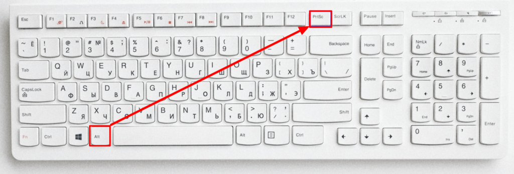 この画像は、Windows コンピューターで「Alt+PrintScreen」を使用してスクリーンショットを撮る方法を示しています。